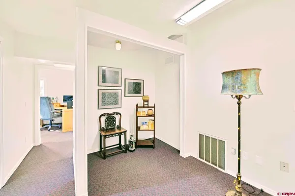 a view of a workspace with furniture