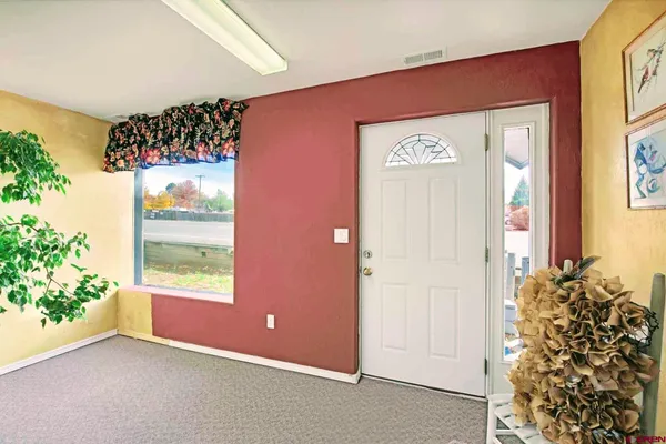 a view of a storage and utility room with washer dryer