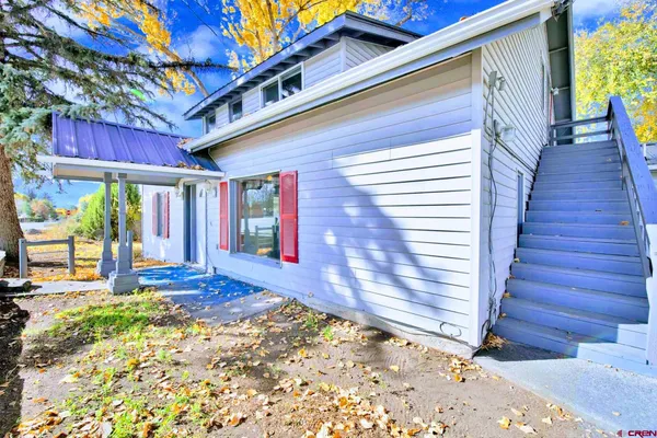 a view of a backyard with a patio