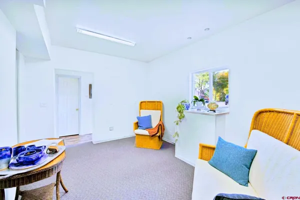 a view of a livingroom with furniture and a couch