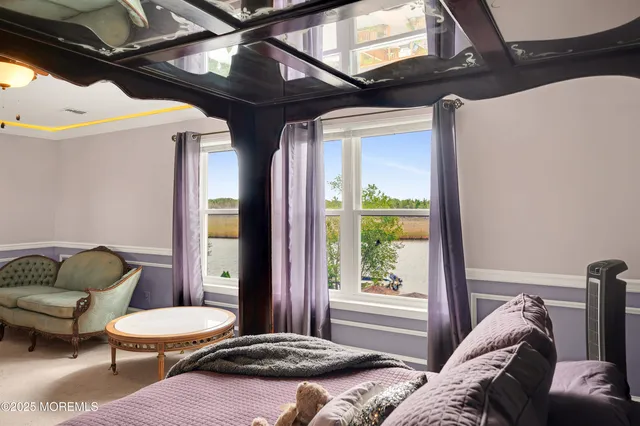 a front view of a house with a yard and potted plants