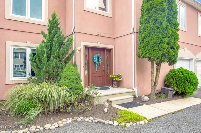 a kitchen with stainless steel appliances a refrigerator and a stove