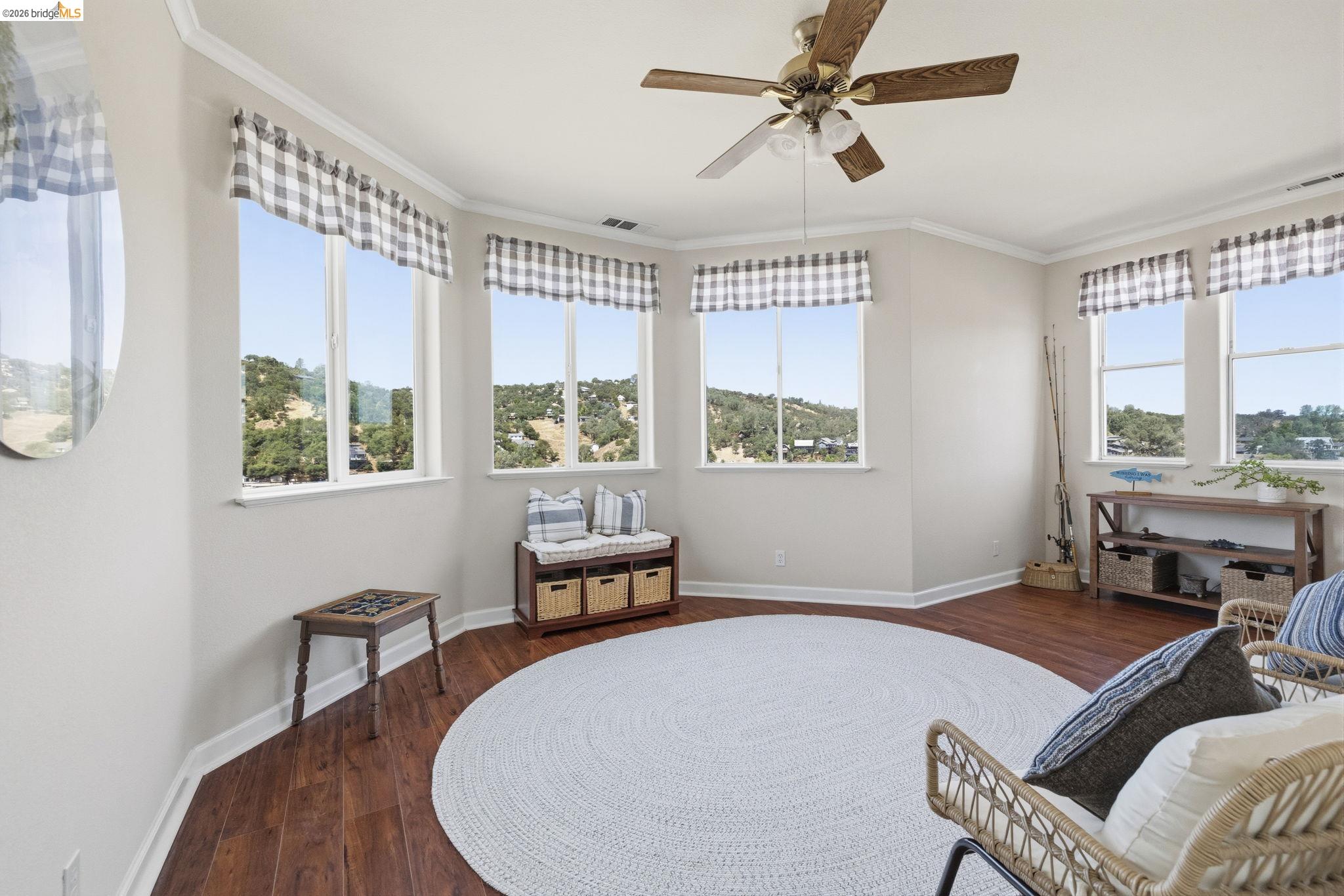 6242 Bluff View Road Copperopolis, CA 95228 - Photo 43 of 59 Light-filled bedroom featuring multiple windows with views of the lake and scenery