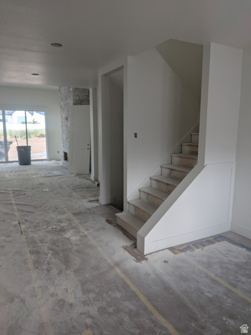 2771 West Aurora Avenue Mapleton, UT 84664 - Photo 20 of 39 Interior staircase featuring white risers and a partial knee wall with trim