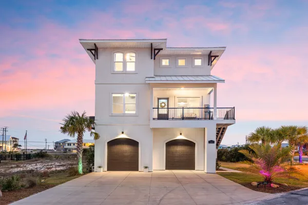 a front view of a house with parking space