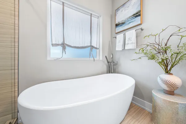 a bedroom with a large bed and a flat screen tv