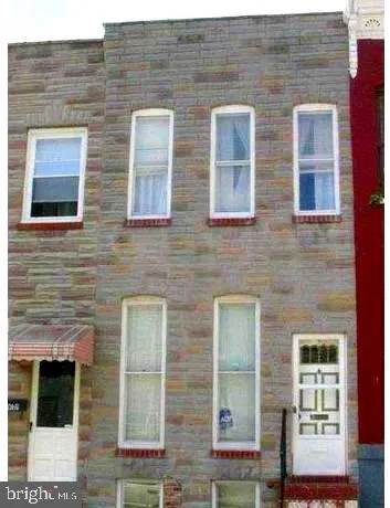 a brick building that has a large window