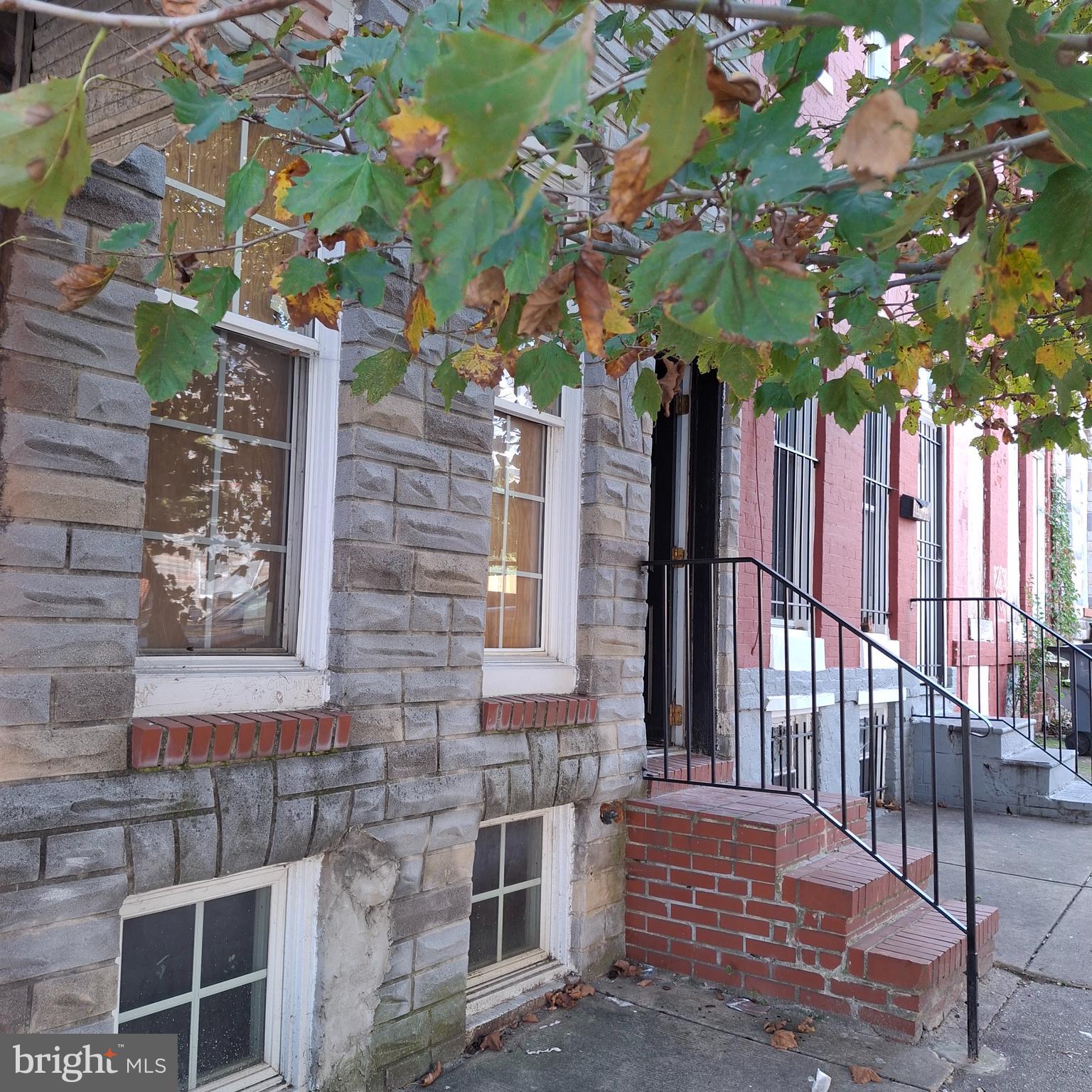 1403 Ramsay Street Baltimore, MD 21223 - Photo 10 of 30 a front view of a house with a tree