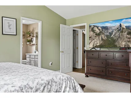 a bedroom with a bed and a dresser