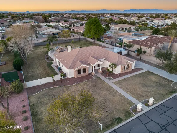 an aerial view of a house with a yard