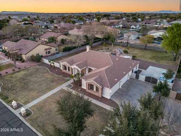 an aerial view of a house with outdoor space and lake view