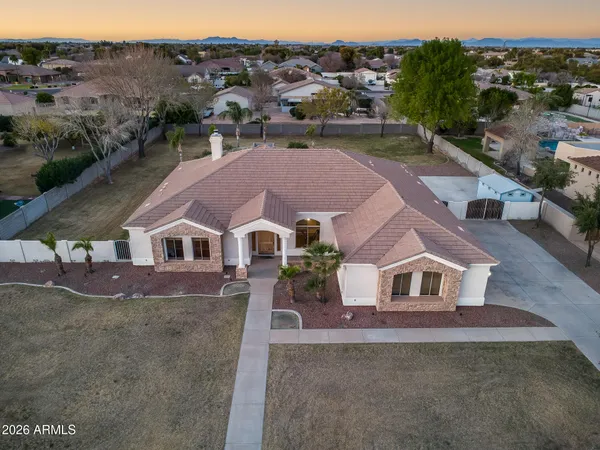 a aerial view of a house with a yard
