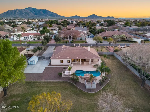 an aerial view of a house with a yard