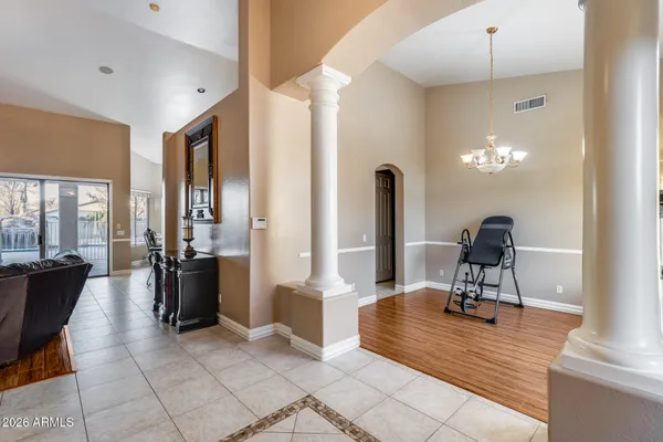a backyard of a house with table and chairs