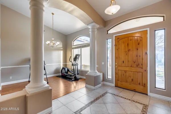 a view of backyard with swimming pool and seating space