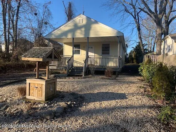 a view of a couches under an umbrella