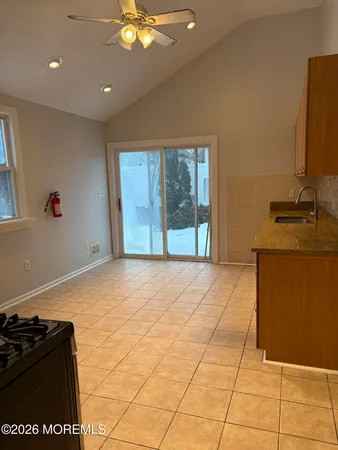 a bedroom with a bed and a stove