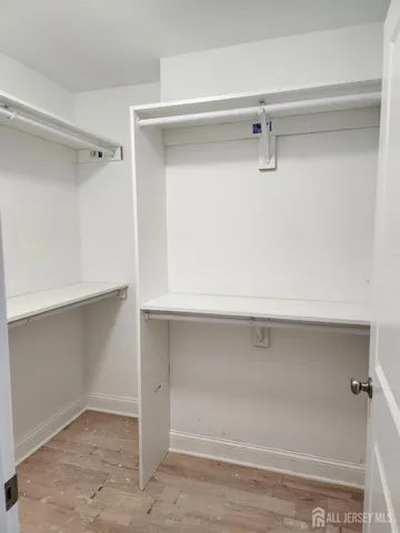 a view of an empty walk in closet