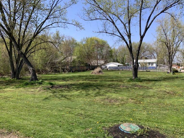 28490 West Main Street Wauconda, IL 60084 - Photo 3 of 4 a view of a backyard with table and chairs and a fire pit