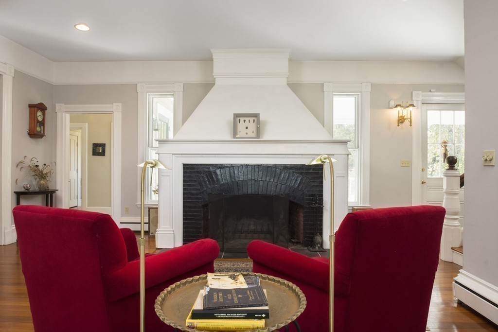 720 Jerusalem Road Cohasset, MA 02025 - Photo 14 of 29 a living room with furniture and a fireplace