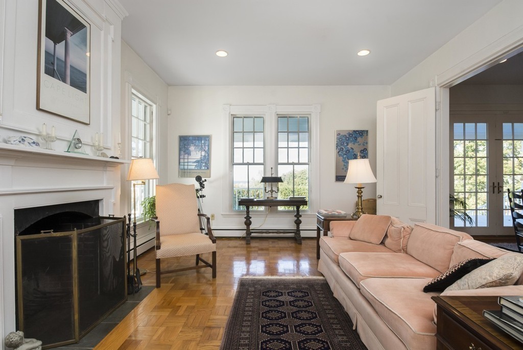 720 Jerusalem Road Cohasset, MA 02025 - Photo 17 of 29 a living room with furniture and a fireplace