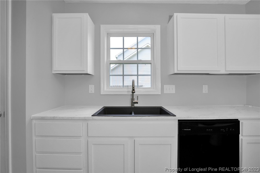 234 Cape Fear Road Raeford, NC 28376 - Photo 11 of 33 a kitchen with a sink and cabinets