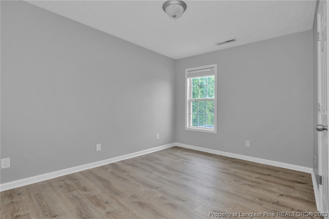 234 Cape Fear Road Raeford, NC 28376 - Photo 20 of 33 wooden floor in an empty room with a window