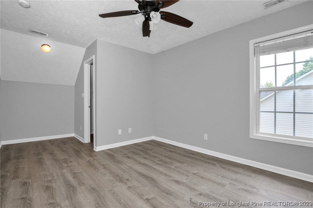 234 Cape Fear Road Raeford, NC 28376 - Photo 25 of 33 wooden floor in an empty room with a window