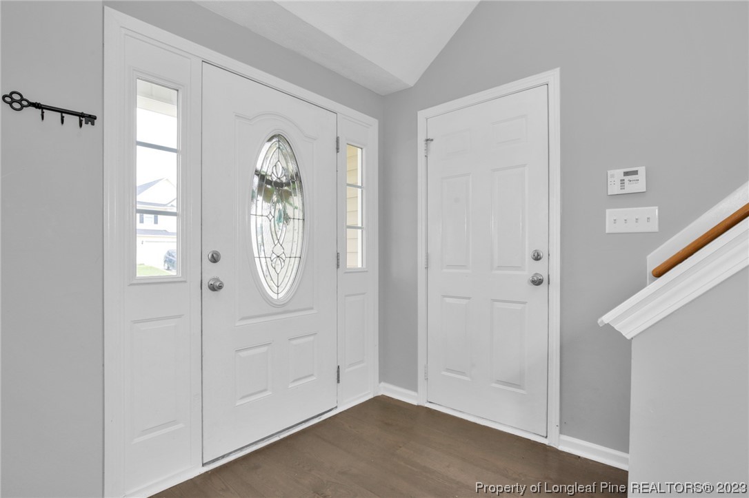 234 Cape Fear Road Raeford, NC 28376 - Photo 3 of 33 a view of an entryway with wooden floor