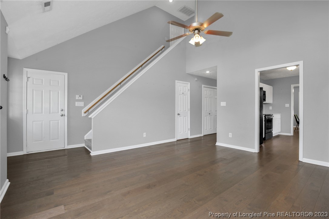 234 Cape Fear Road Raeford, NC 28376 - Photo 5 of 33 a view of an empty room with wooden floor and a ceiling fan