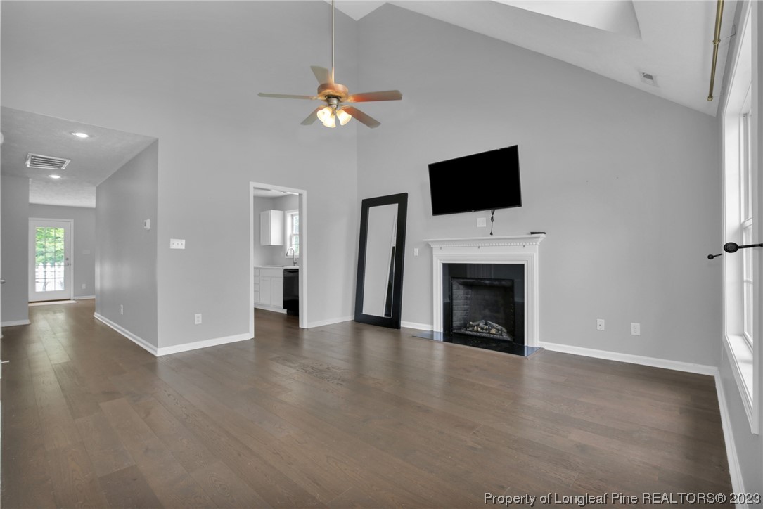 234 Cape Fear Road Raeford, NC 28376 - Photo 7 of 33 a view of a livingroom with an empty space and a fireplace