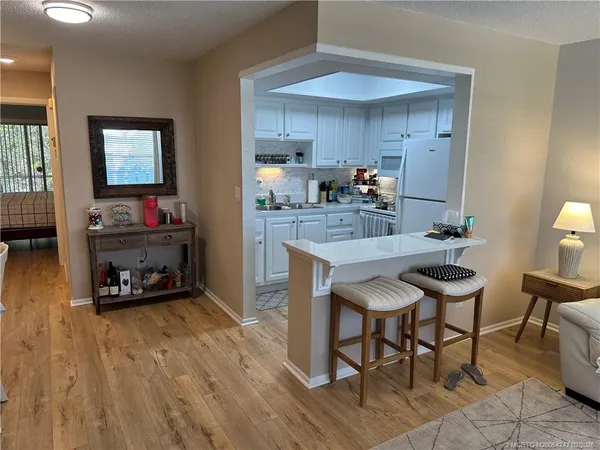 a kitchen with a table and chairs in it