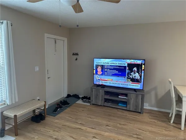 a view of room with furniture and wooden floor