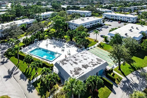 an aerial view of a house with a garden and plants