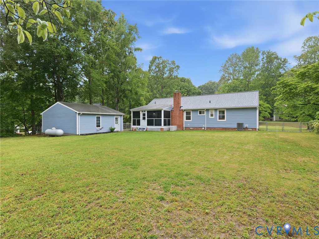 7707 Woodbrook Road Quinton, VA 23141 - Photo 42 of 42 Expansive green lawn with a detached auxiliary bui