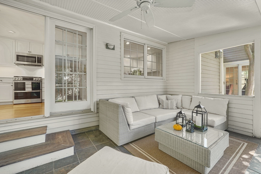 21 Philbrick Road Newton, MA 02459 - Photo 17 of 35 a living room with furniture and floor to ceiling windows