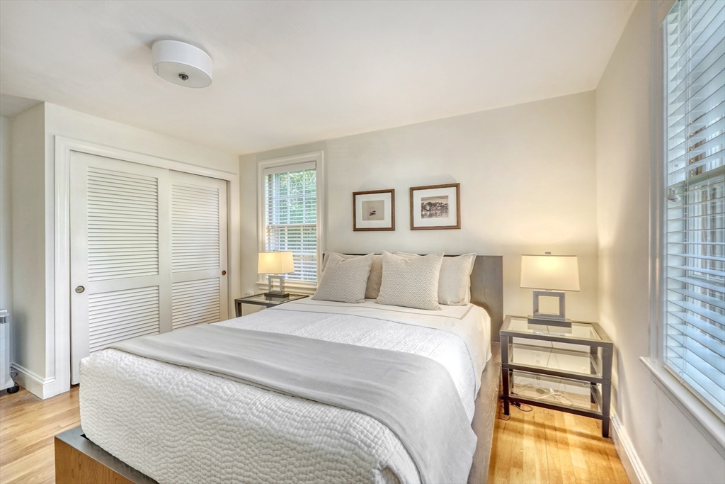 21 Philbrick Road Newton, MA 02459 - Photo 18 of 35 a bedroom with a bed and a night stand