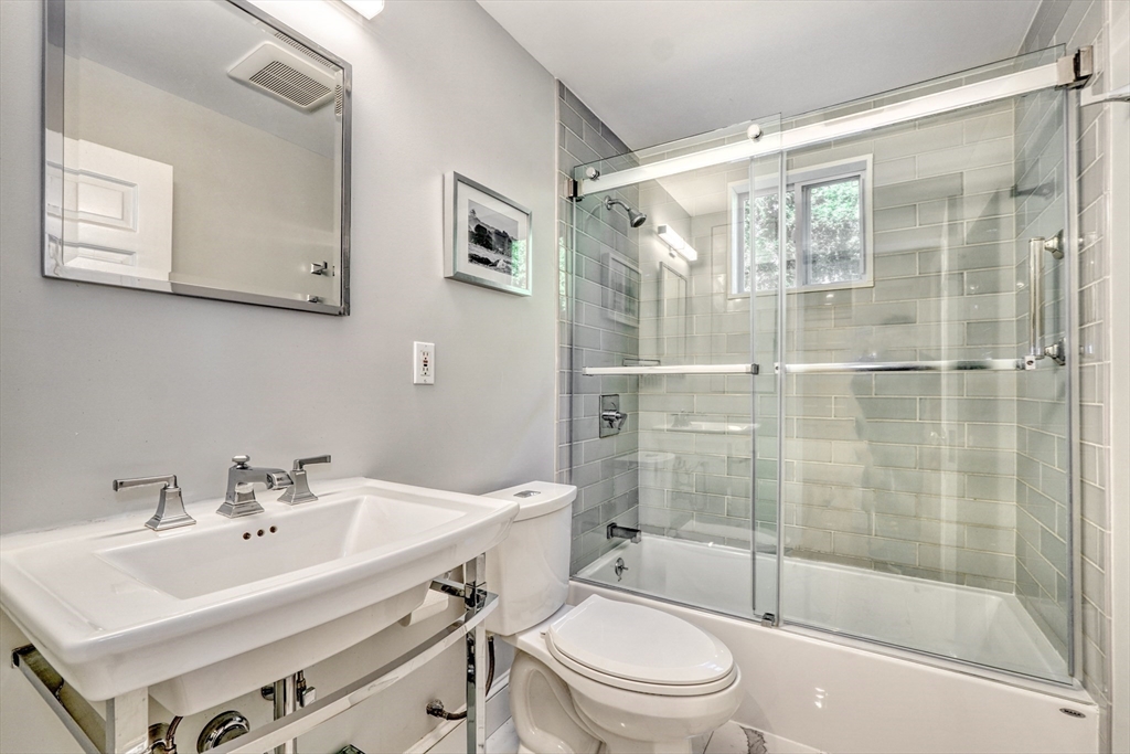 21 Philbrick Road Newton, MA 02459 - Photo 23 of 35 a bathroom with a sink toilet and shower