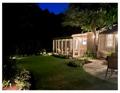 a view of backyard with patio