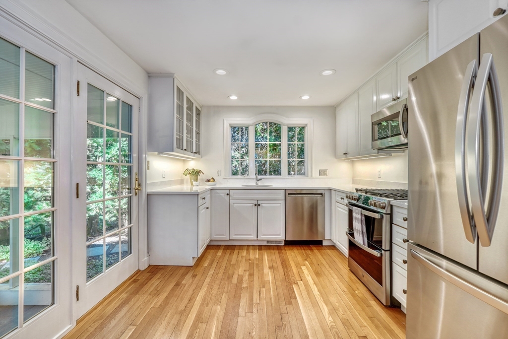 21 Philbrick Road Newton, MA 02459 - Photo 9 of 35 a kitchen with a refrigerator sink and stove