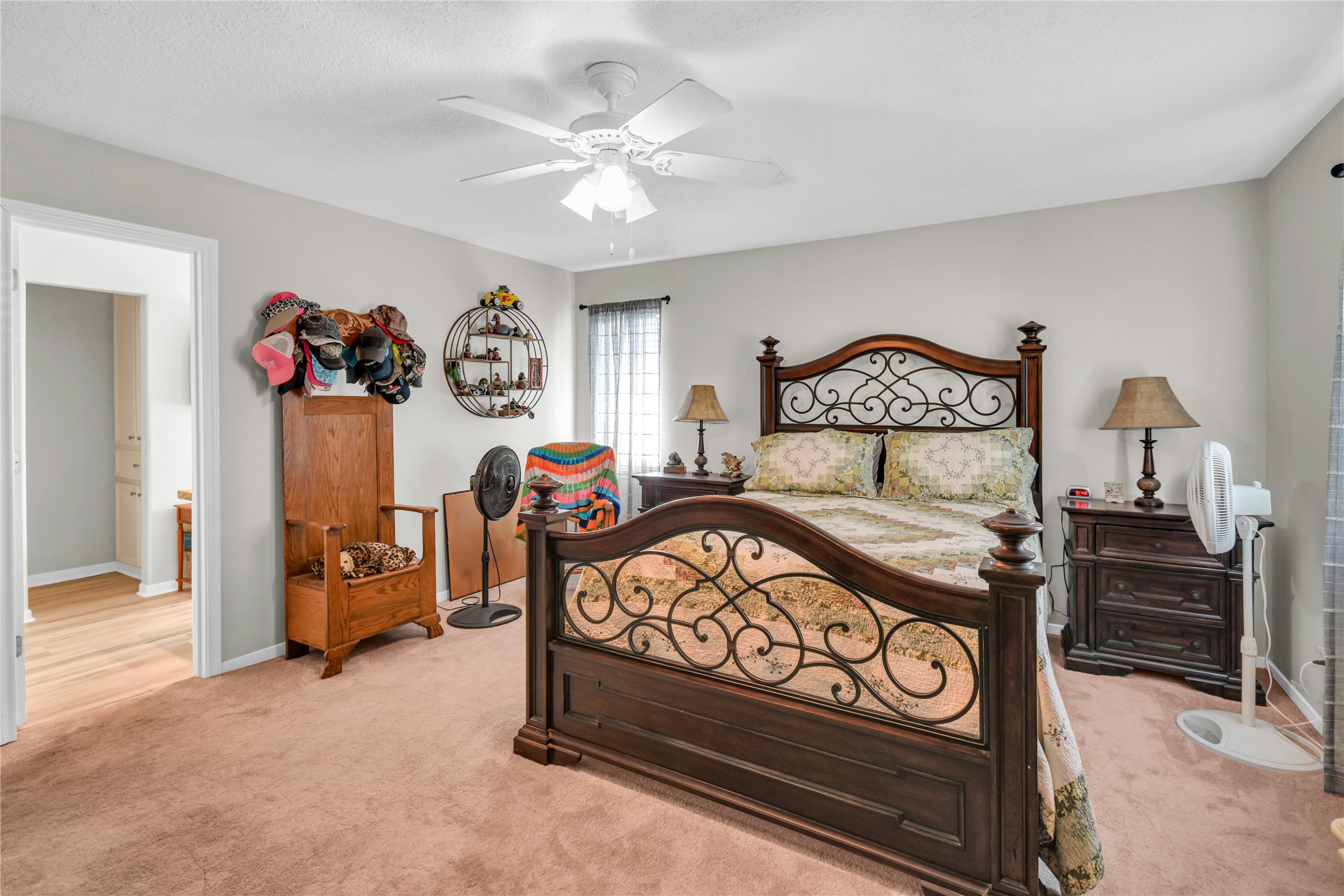 115 Driftwood Road Freeport, TX 77541 - Photo 16 of 21 a bedroom with a bed and a chandelier