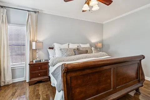 a bedroom with a bed and a tv