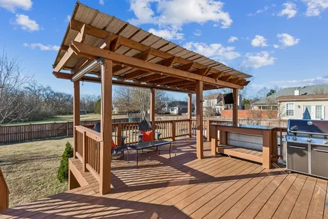 a view of a backyard with sitting area