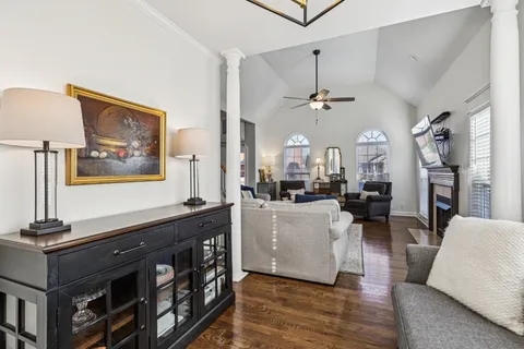 a view of living room with furniture and a chandelier