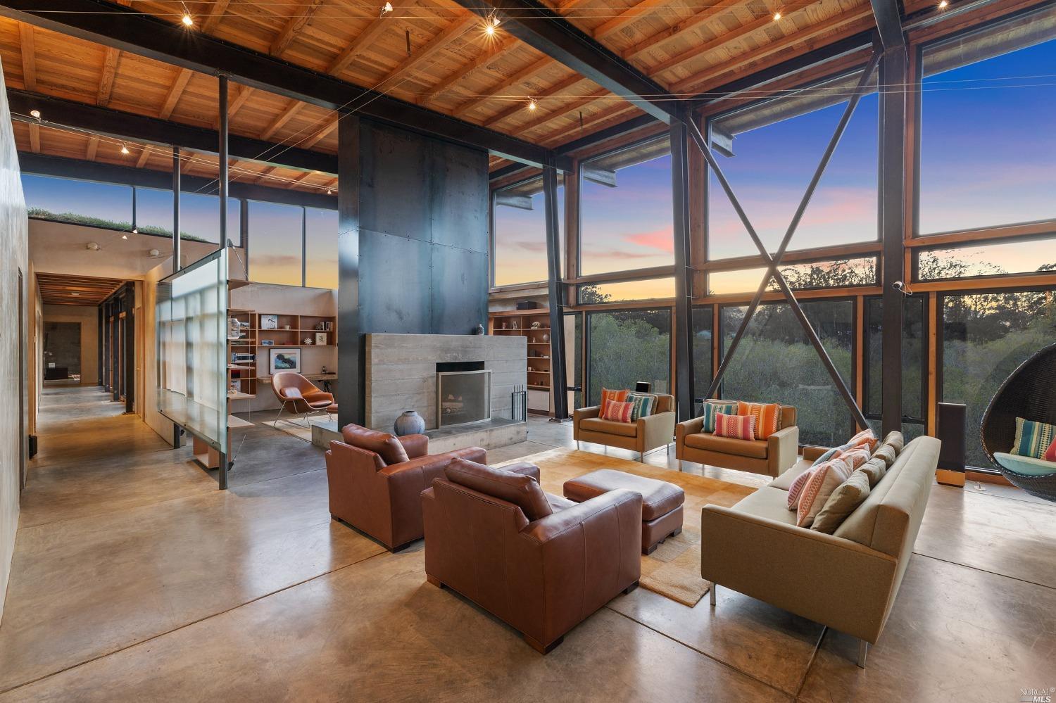 30 Knob Hill Road Point Reyes Station, CA 94956 - Photo 1 of 1 a outdoor living space with patio furniture and a fireplace