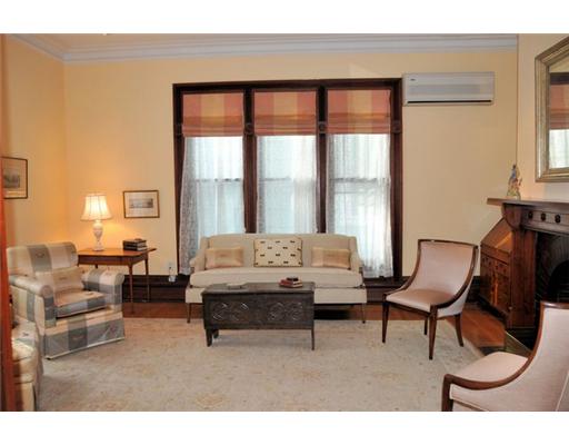 54 Barnes Street Providence, RI 02906 - Photo 4 of 12 Living Room. Spacious living room with two sets of long windows and fireplace