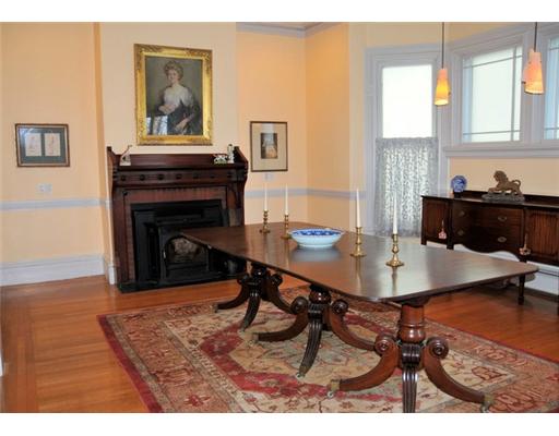 54 Barnes Street Providence, RI 02906 - Photo 6 of 12 Dining Room. Dining room with fireplace and glass door leading to gardens/patio. Original butler s pantry with glass fronted cabinets and drawers.