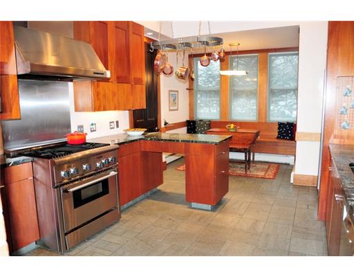 54 Barnes Street Providence, RI 02906 - Photo 7 of 12 Kitchen. Architect designed cook s kitchen with original brick hearth/fireplace. Glass fronted cabinets, granite countertops, slate floor. Eating area with built in bench.