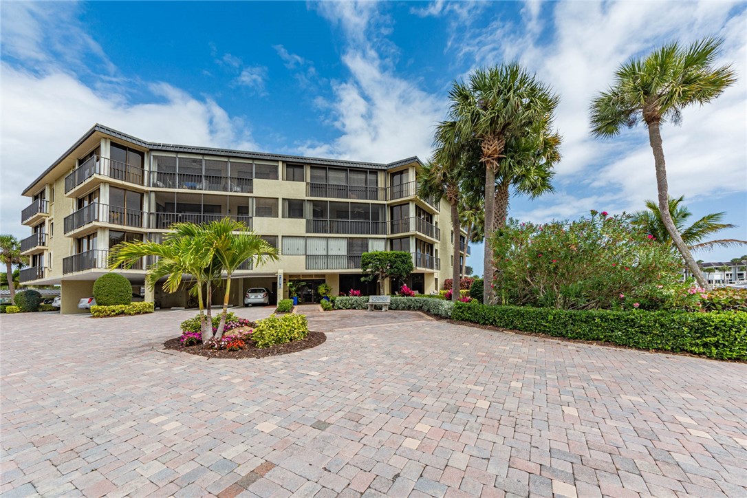1850 Bay Road, Unit 3G Vero Beach, FL 32963 - Photo 1 of 36 a view of backyard with a table and chair and potted plants