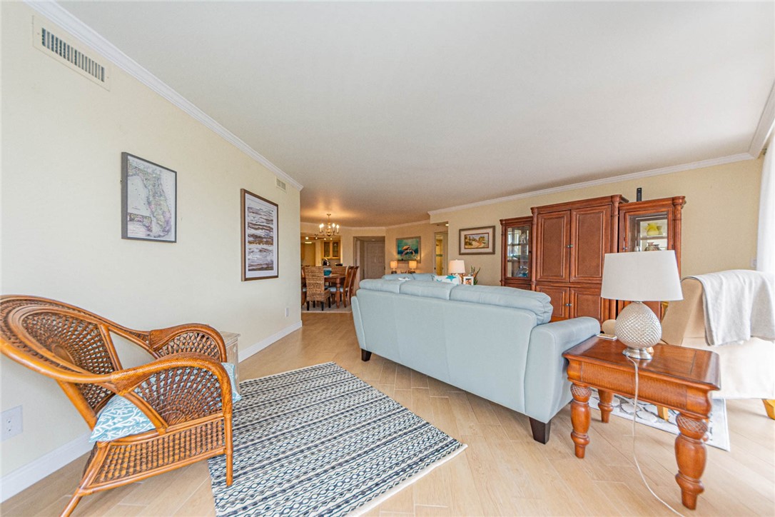 1850 Bay Road, Unit 3G Vero Beach, FL 32963 - Photo 11 of 36 a living room with furniture and a wooden floor